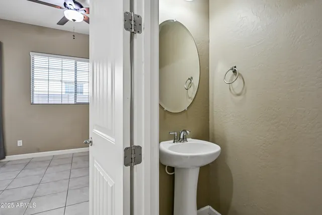 a bathroom with a sink a mirror and shower