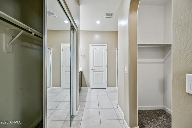 a bathroom with a glass shower door and a glass door