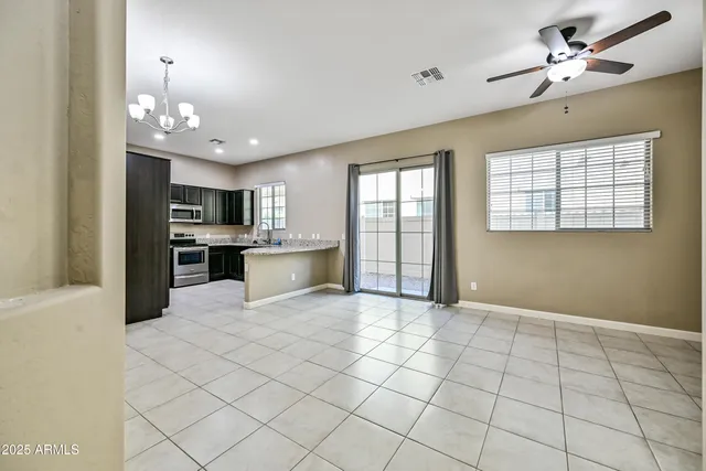 a view of a kitchen with microwave and cabinets