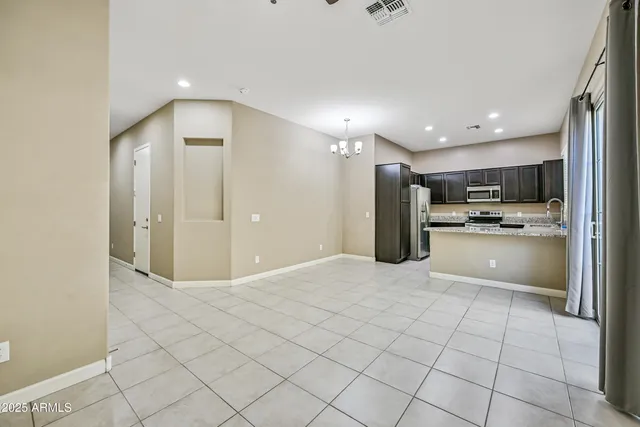 a view of kitchen cabinets and refrigerator