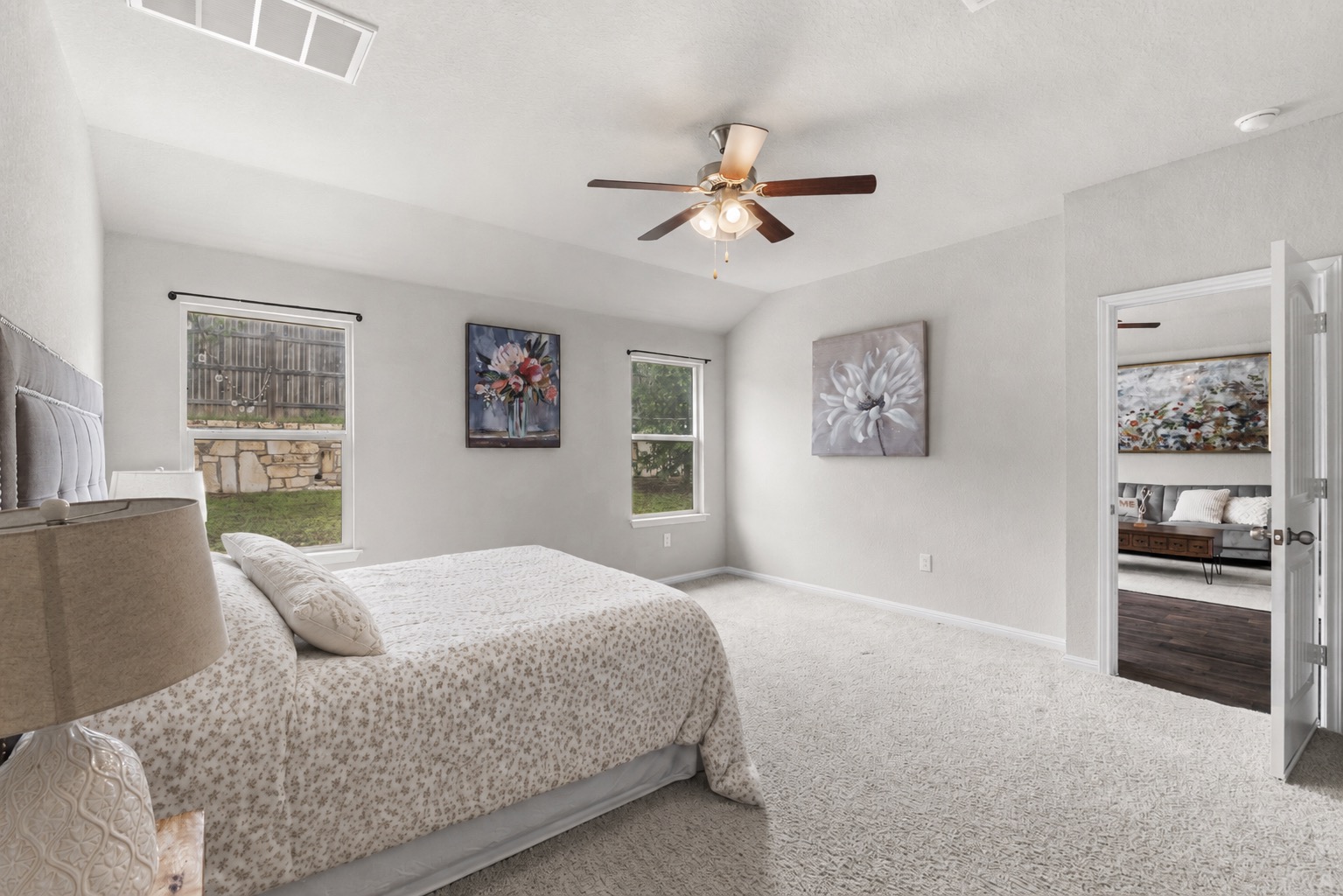 10809 Gonzales Ranger Pass Austin, TX 78754 - Photo 20 of 37 Privately secluded away overlooking the backyard, the spacious primary suite serves as your peaceful getaway for rest and relaxation.