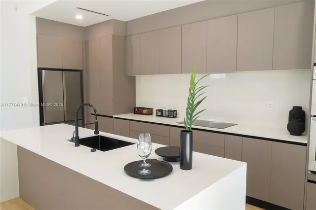 a living room with furniture fireplace and a large window