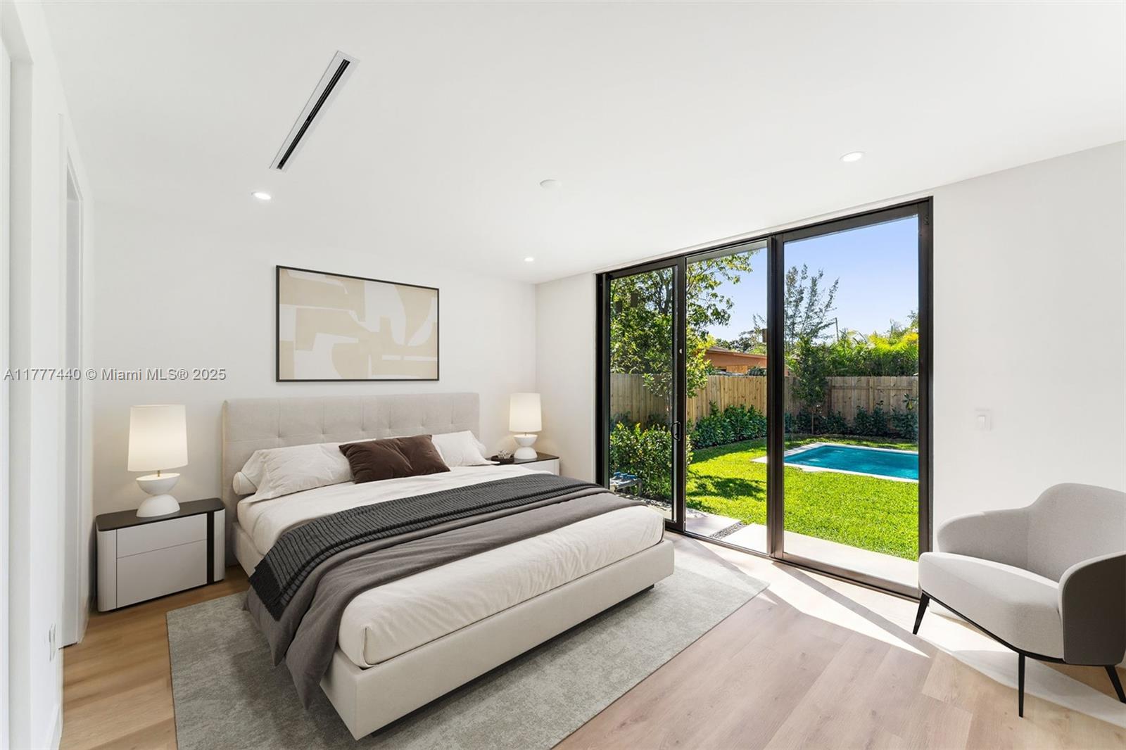 412 Northwest 47th Street Miami, FL 33127 - Photo 21 of 62 a bedroom with a bed and a large window