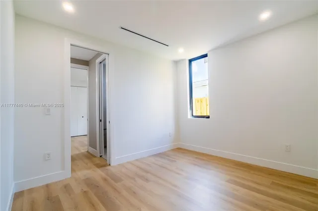 a white toilet sitting next to a bath tub