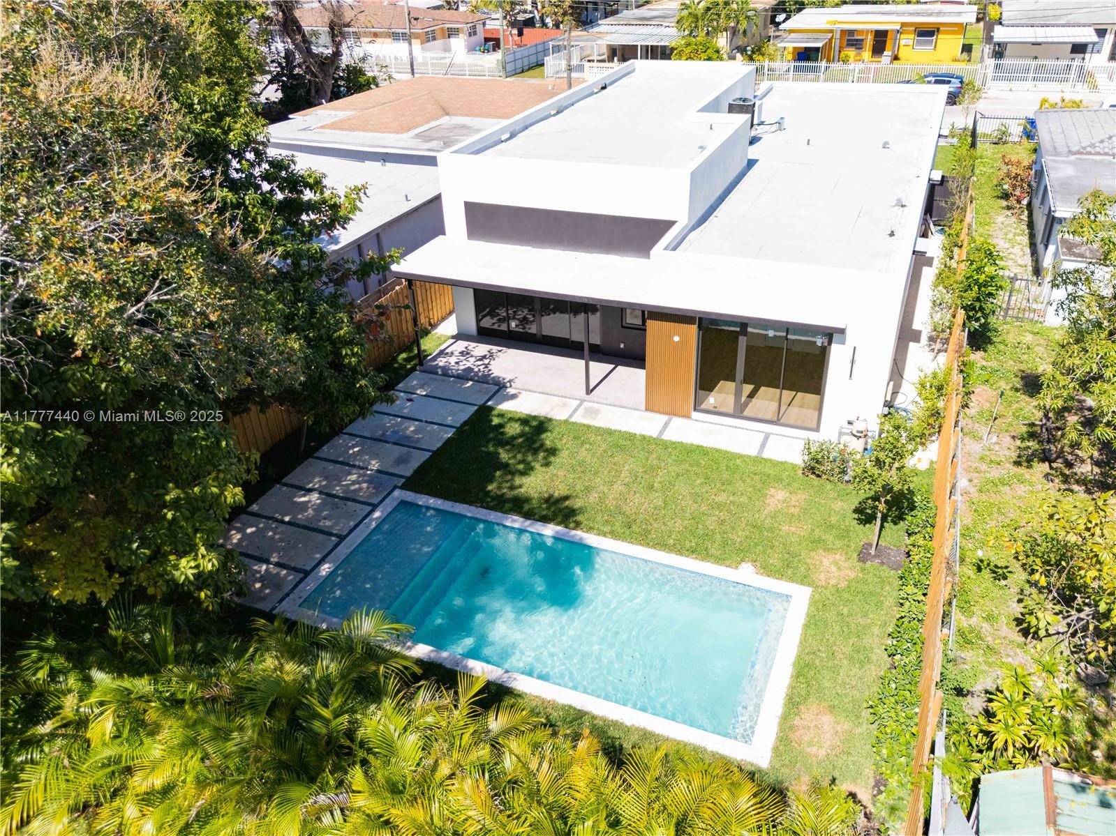 412 Northwest 47th Street Miami, FL 33127 - Photo 3 of 62 a view of a house with a yard