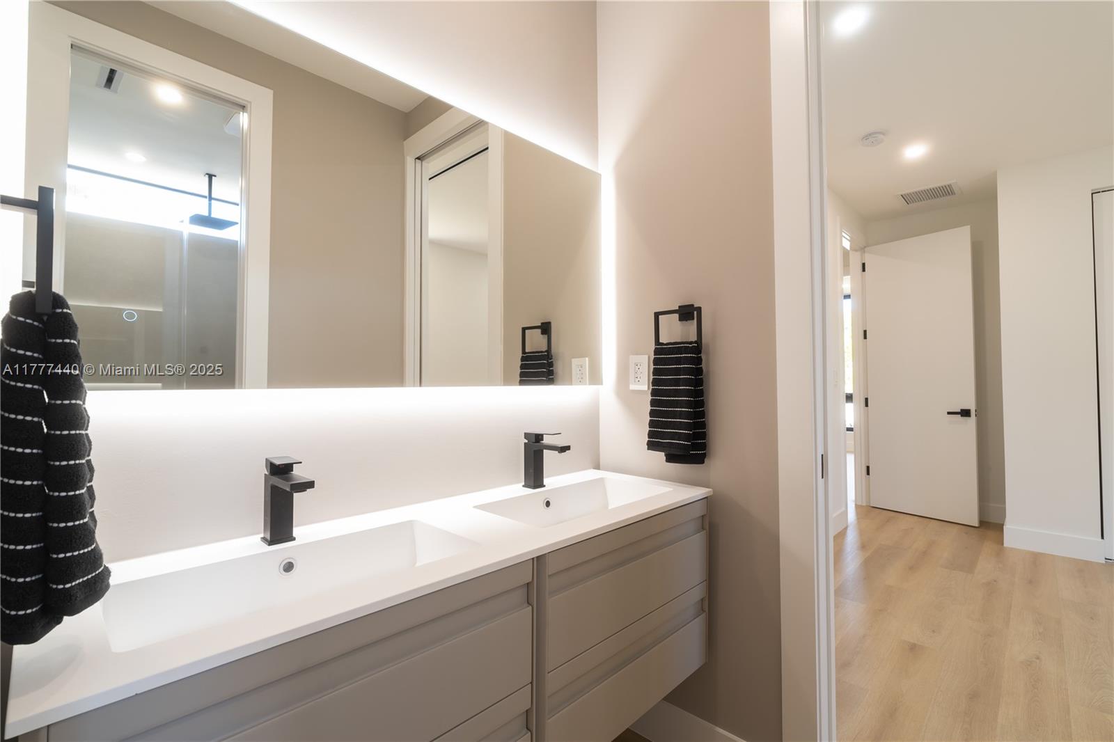 412 Northwest 47th Street Miami, FL 33127 - Photo 32 of 62 a bathroom with a sink and a mirror