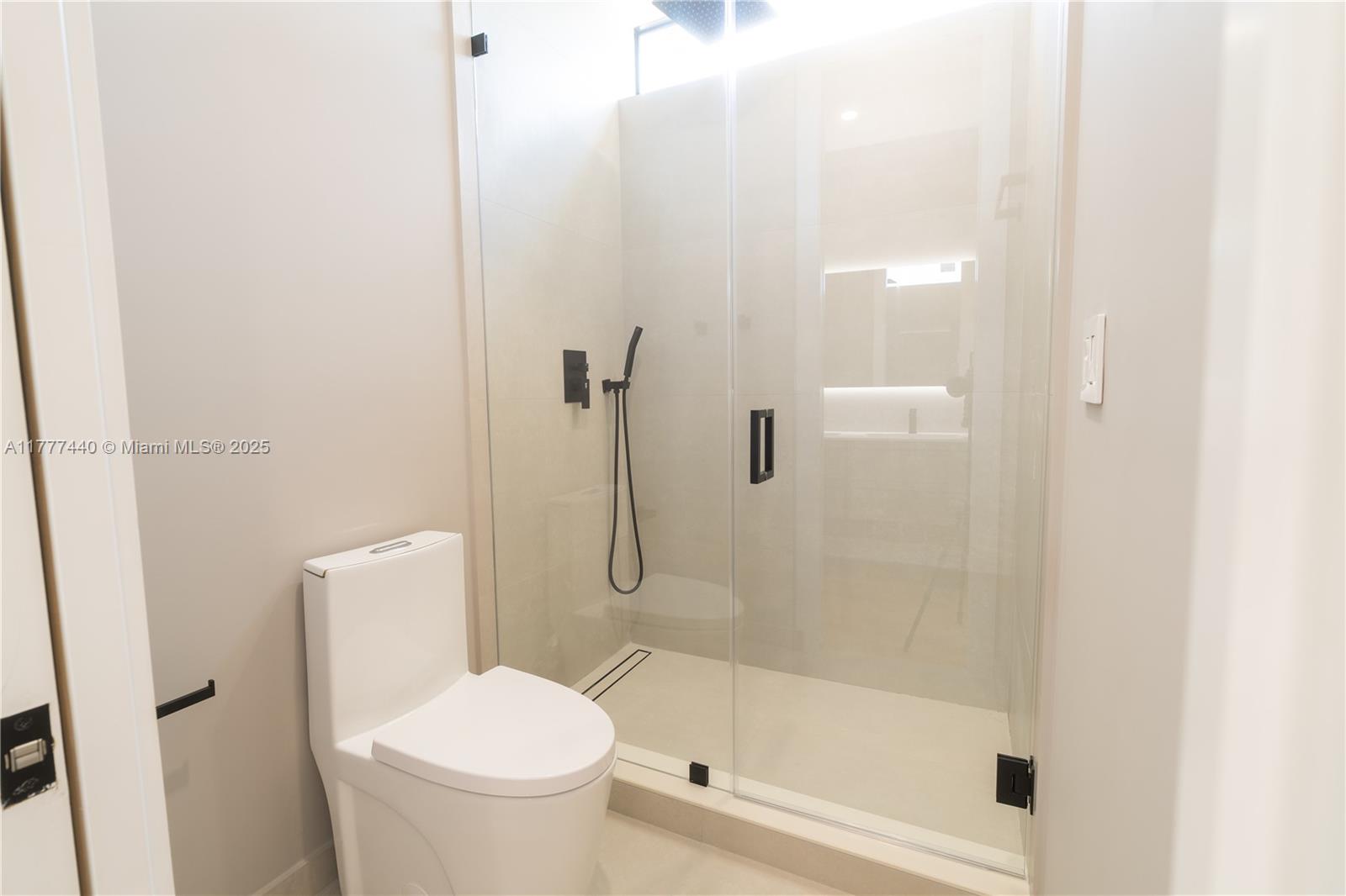 412 Northwest 47th Street Miami, FL 33127 - Photo 33 of 62 a white toilet sitting next to a bath tub