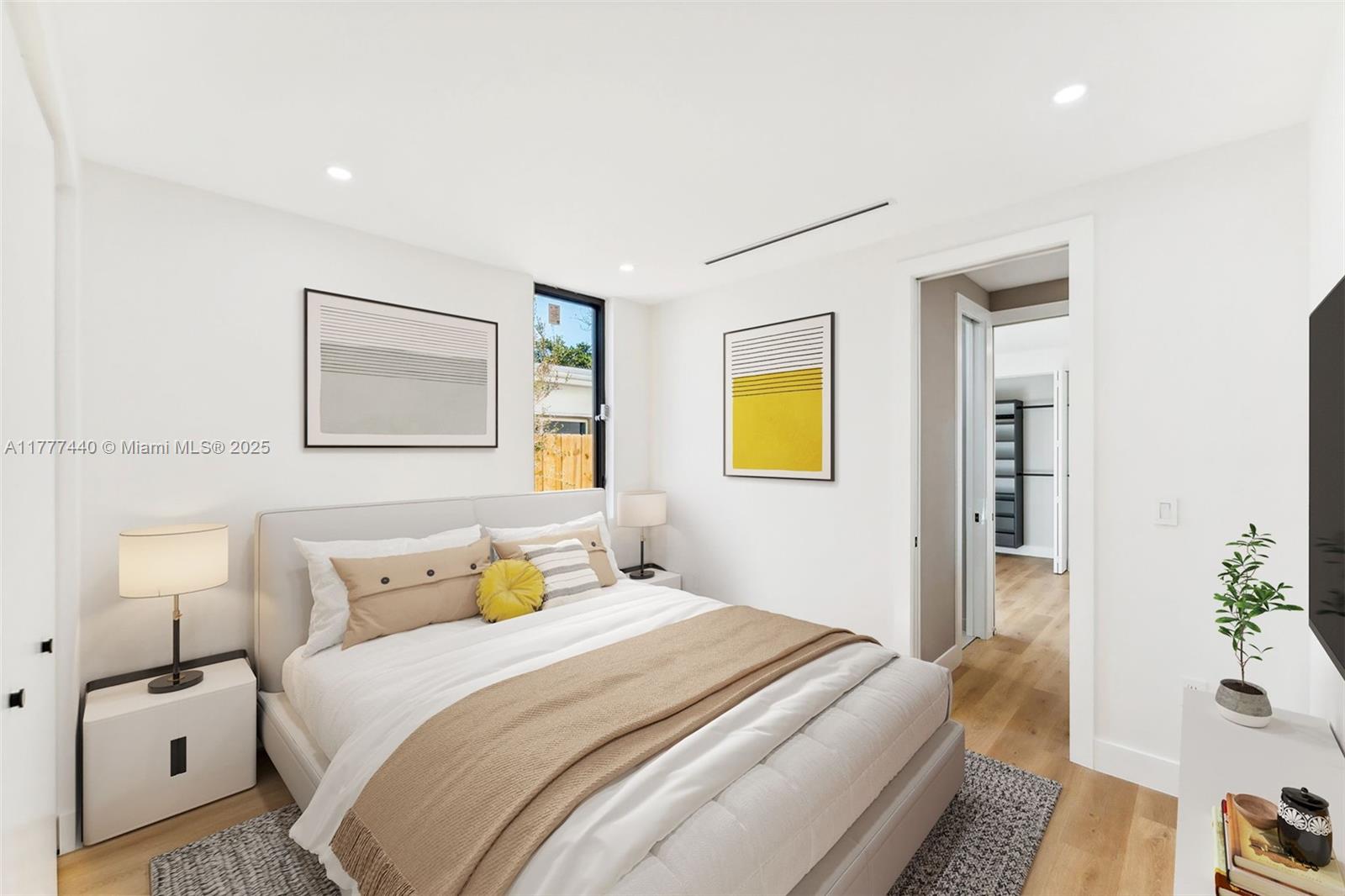 412 Northwest 47th Street Miami, FL 33127 - Photo 36 of 62 a bedroom with a bed and wooden floor