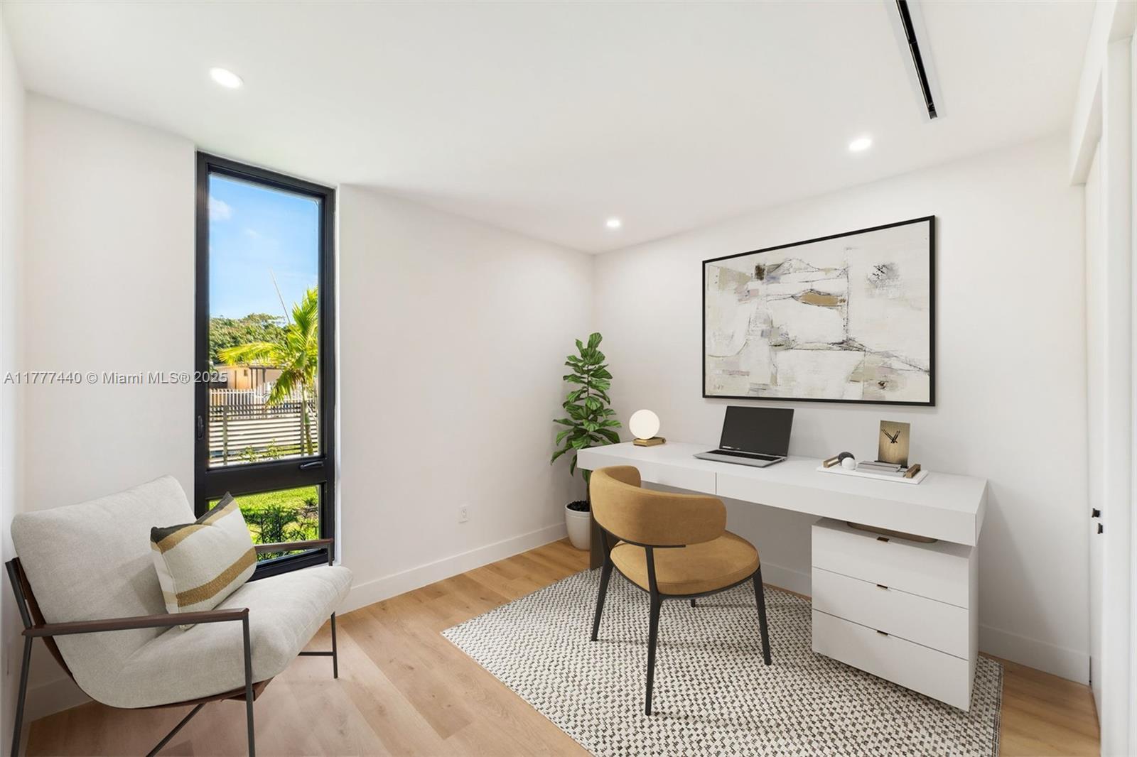 412 Northwest 47th Street Miami, FL 33127 - Photo 38 of 62 a view of a workspace with furniture and a window