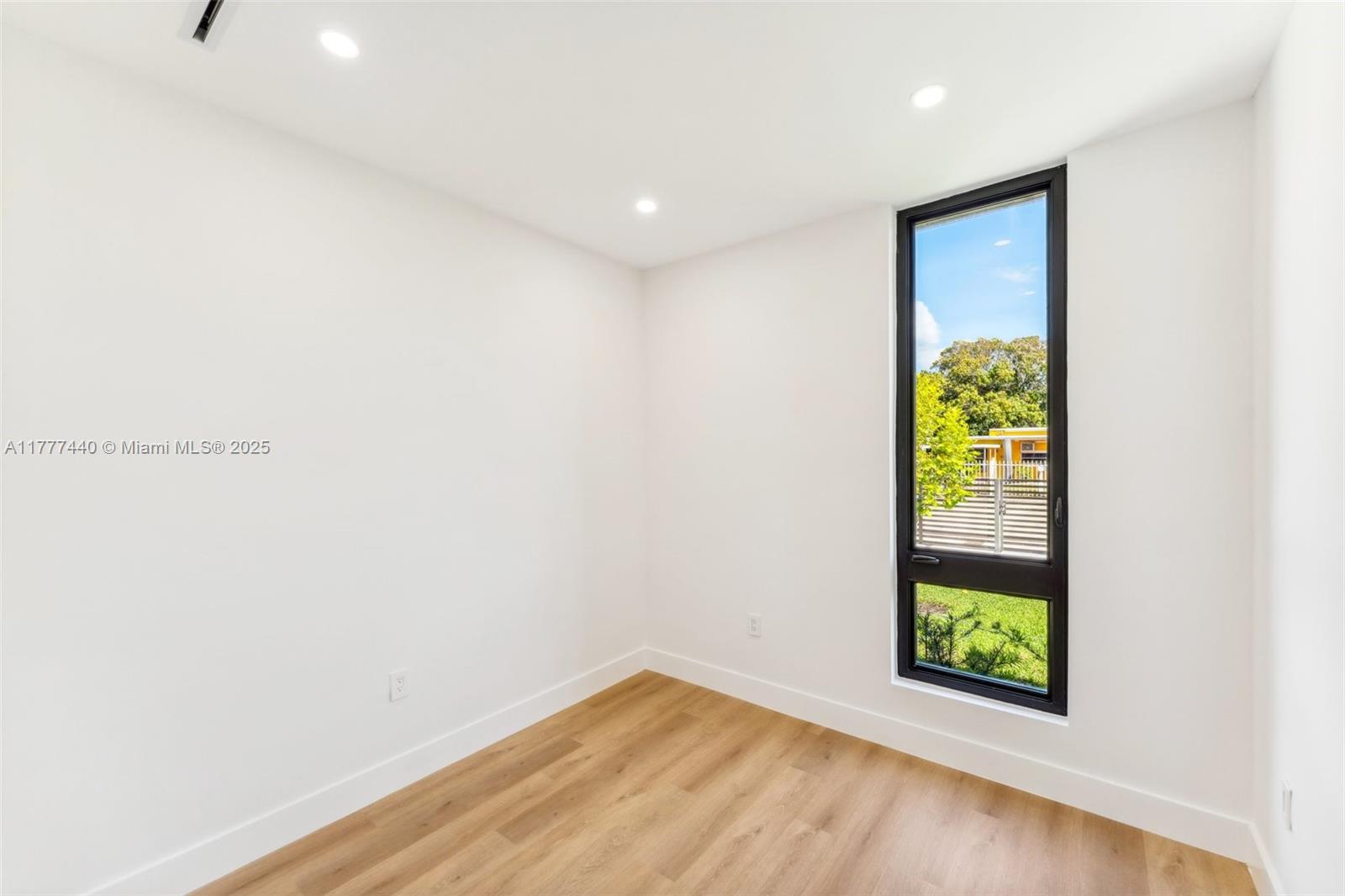 412 Northwest 47th Street Miami, FL 33127 - Photo 40 of 62 a view of an empty room with a window
