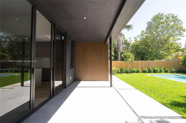 a view of a chairs and table in patio