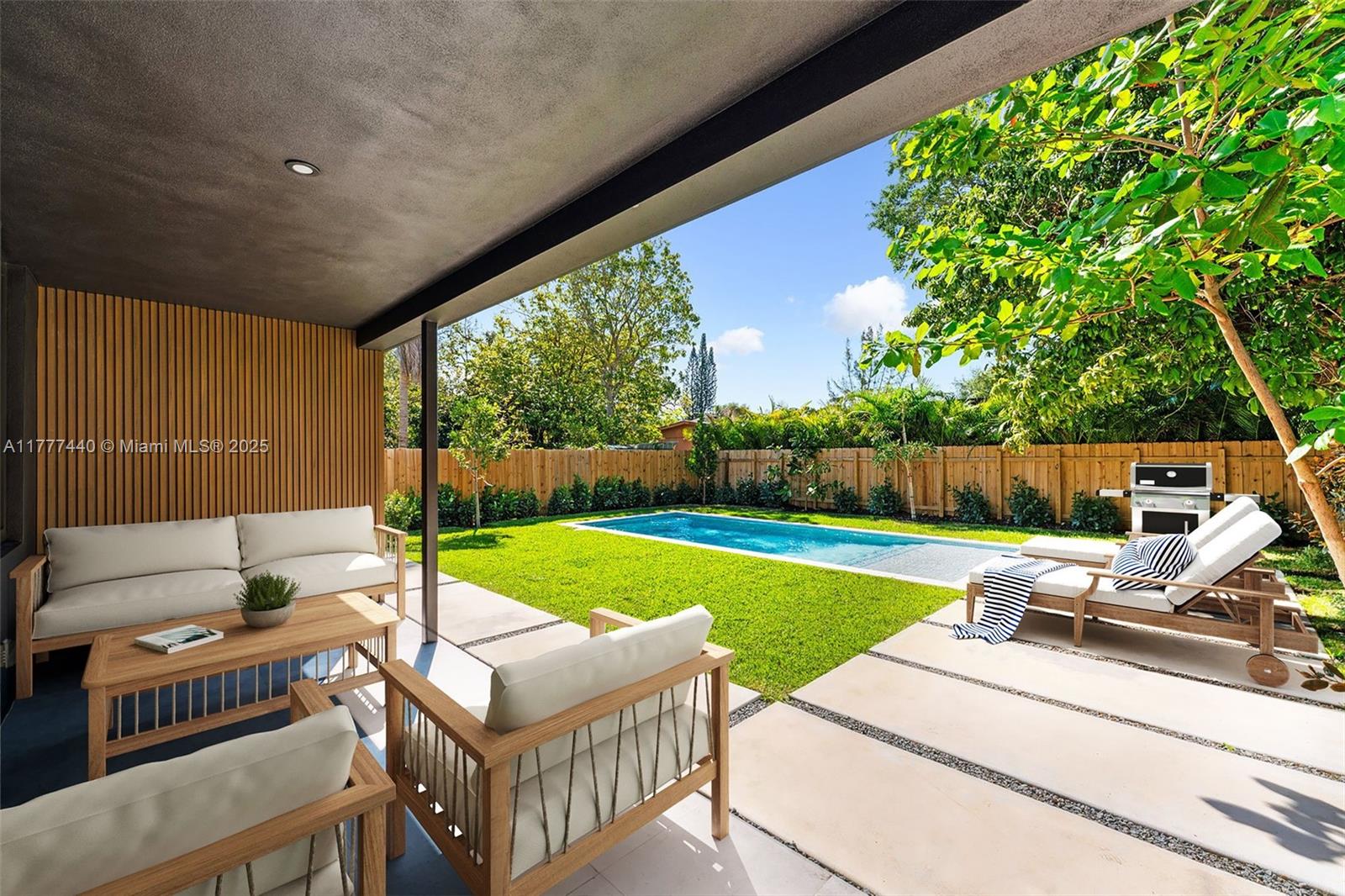 412 Northwest 47th Street Miami, FL 33127 - Photo 48 of 62 a view of a patio with a yard