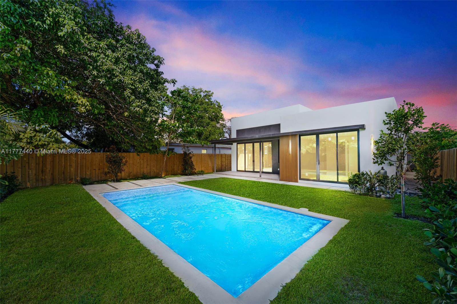 412 Northwest 47th Street Miami, FL 33127 - Photo 50 of 62 a view of a backyard with a garden and deck