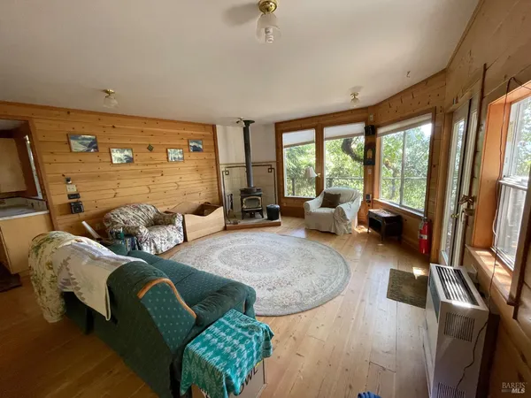 a spacious bedroom with a bed and a window