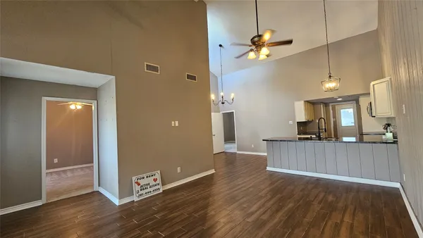a view of a livingroom with wooden floor