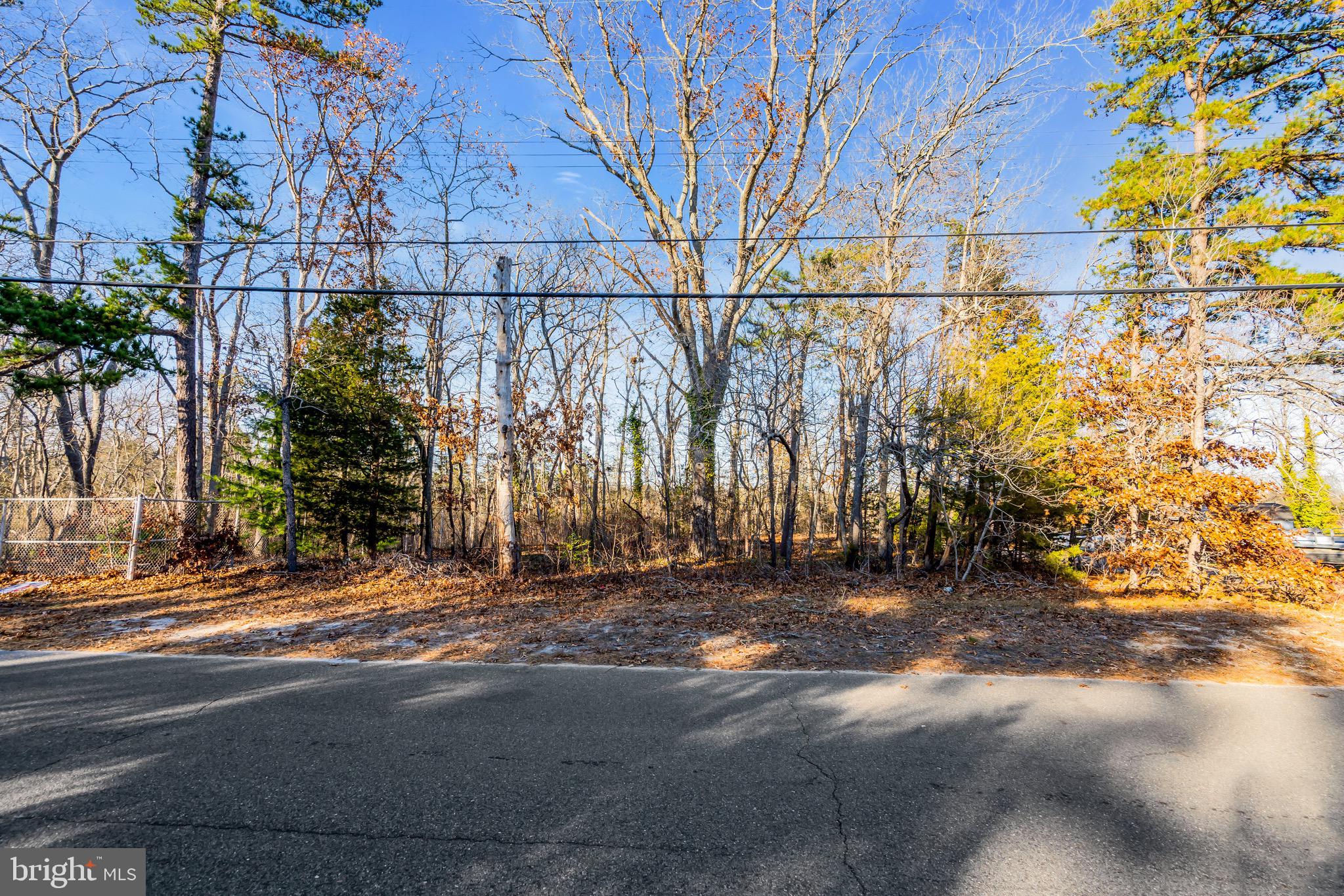 3 Dock Avenue Waretown, NJ 08758 - Photo 16 of 19 a view of a street with a building in the background