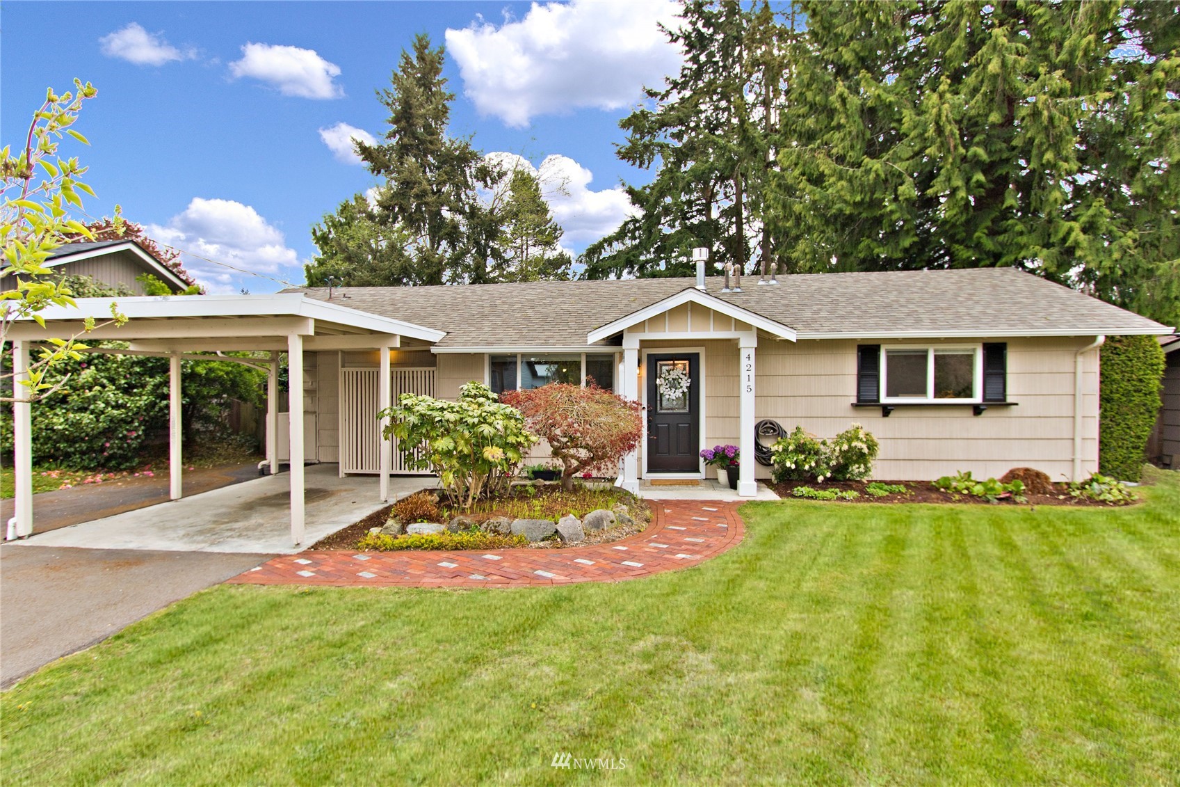 4215 Southeast 3rd Street Renton, WA 98059 - Photo 1 of 30 a front view of a house with a yard