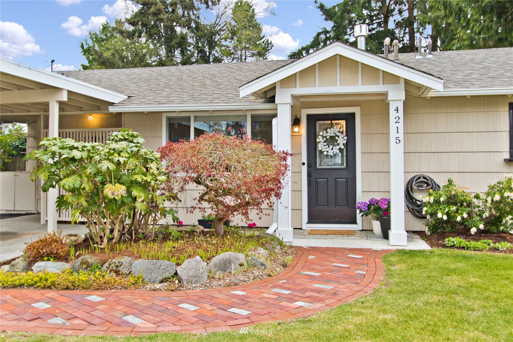 4215 Southeast 3rd Street Renton, WA 98059 - Photo 2 of 30 a front view of a house with garden