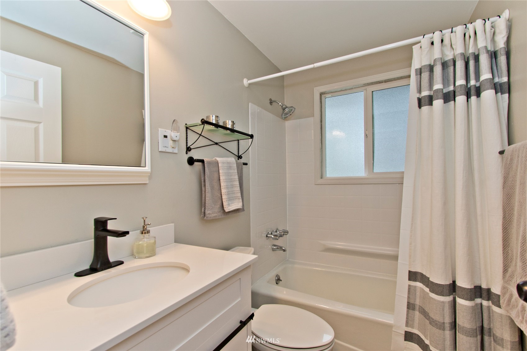 4215 Southeast 3rd Street Renton, WA 98059 - Photo 21 of 30 a bathroom with a sink toilet and shower