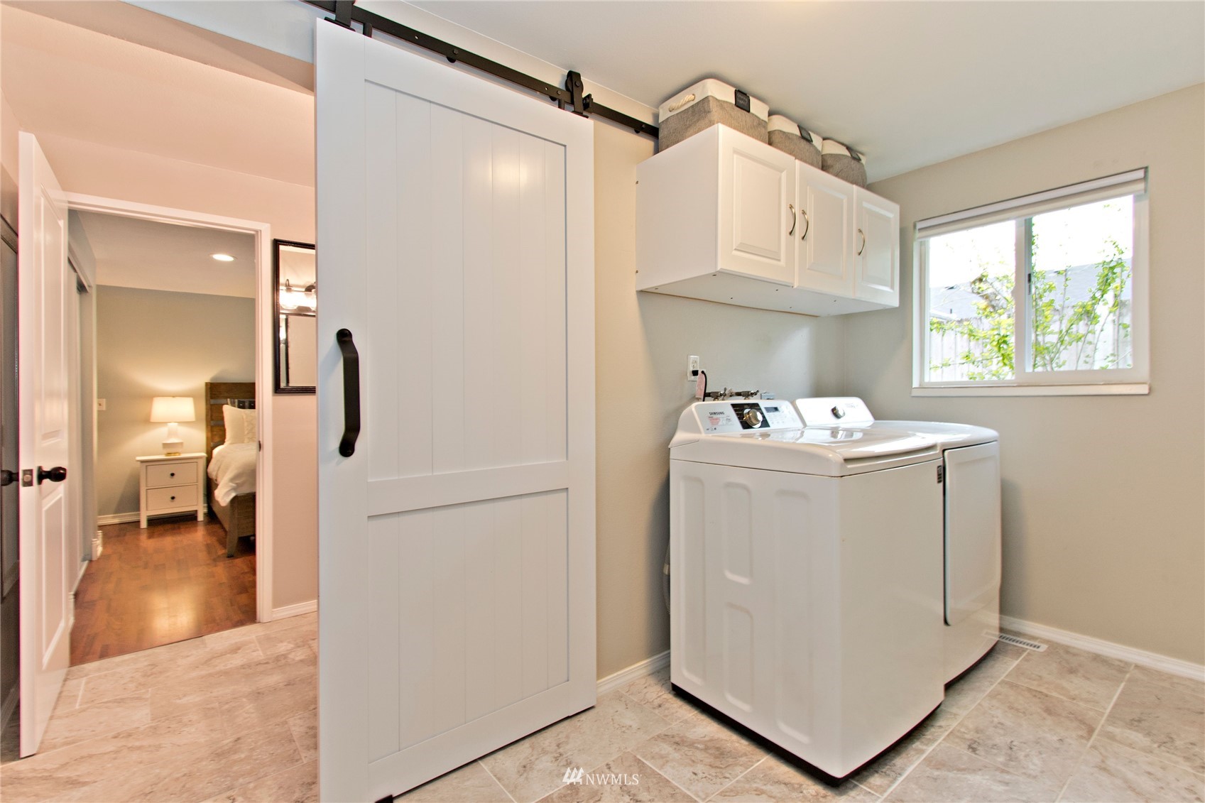 4215 Southeast 3rd Street Renton, WA 98059 - Photo 22 of 30 a utility room with cabinets washer and dryer