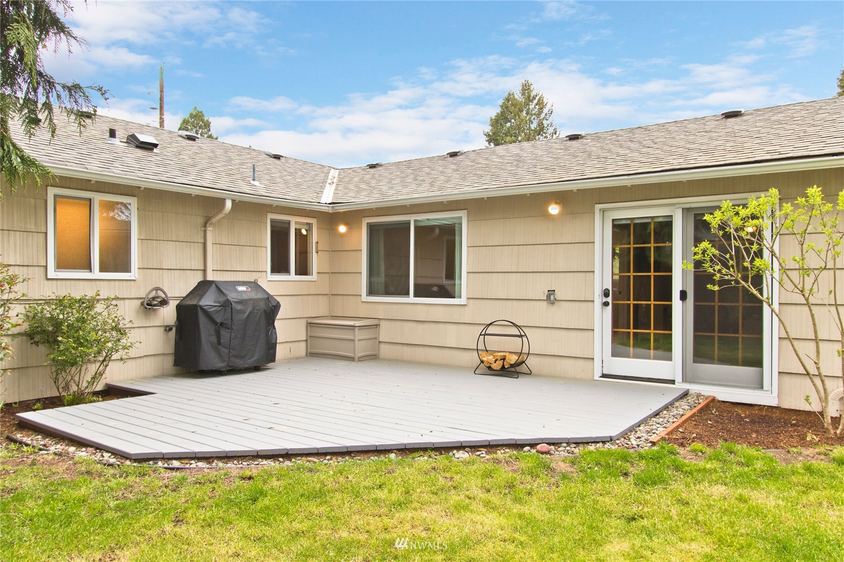 4215 Southeast 3rd Street Renton, WA 98059 - Photo 25 of 30 a view of a patio with table and chairs potted plants and a large tree
