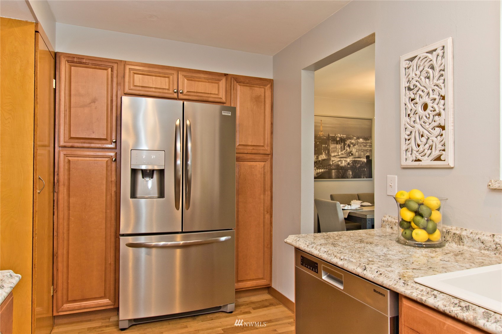 4215 Southeast 3rd Street Renton, WA 98059 - Photo 8 of 30 a kitchen with stainless steel appliances granite countertop a refrigerator and a sink