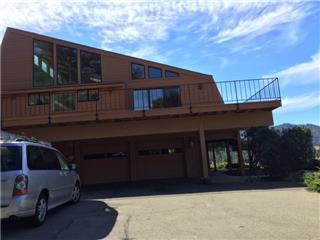 15525 Bohlman Road Saratoga, CA 95070 - Photo 4 of 8 a front view of a house with a yard