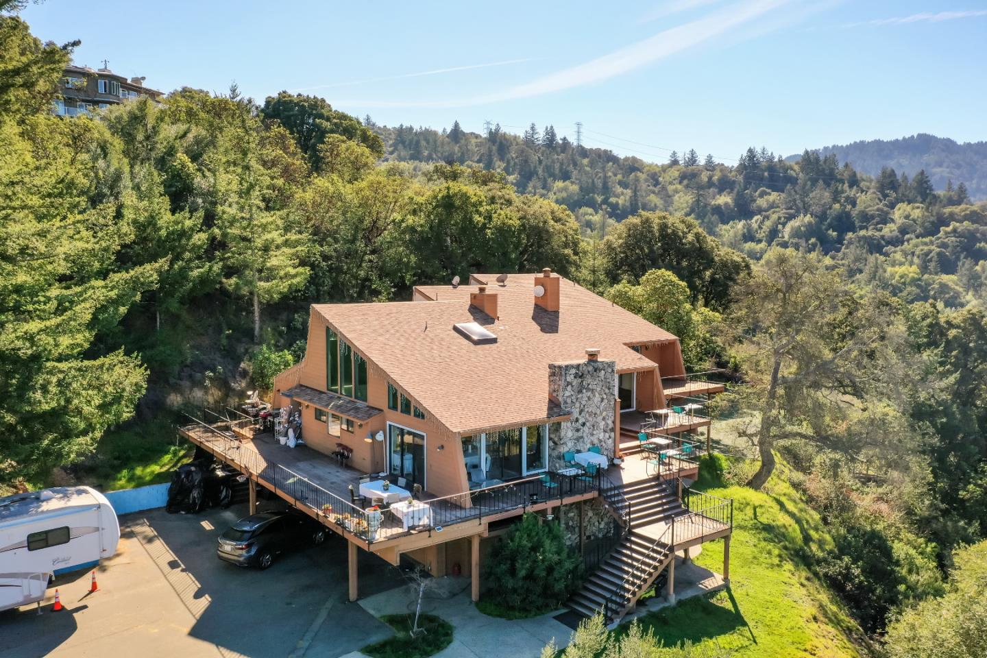 15525 Bohlman Road Saratoga, CA 95070 - Photo 8 of 8 an aerial view of a house with a big yard and large trees