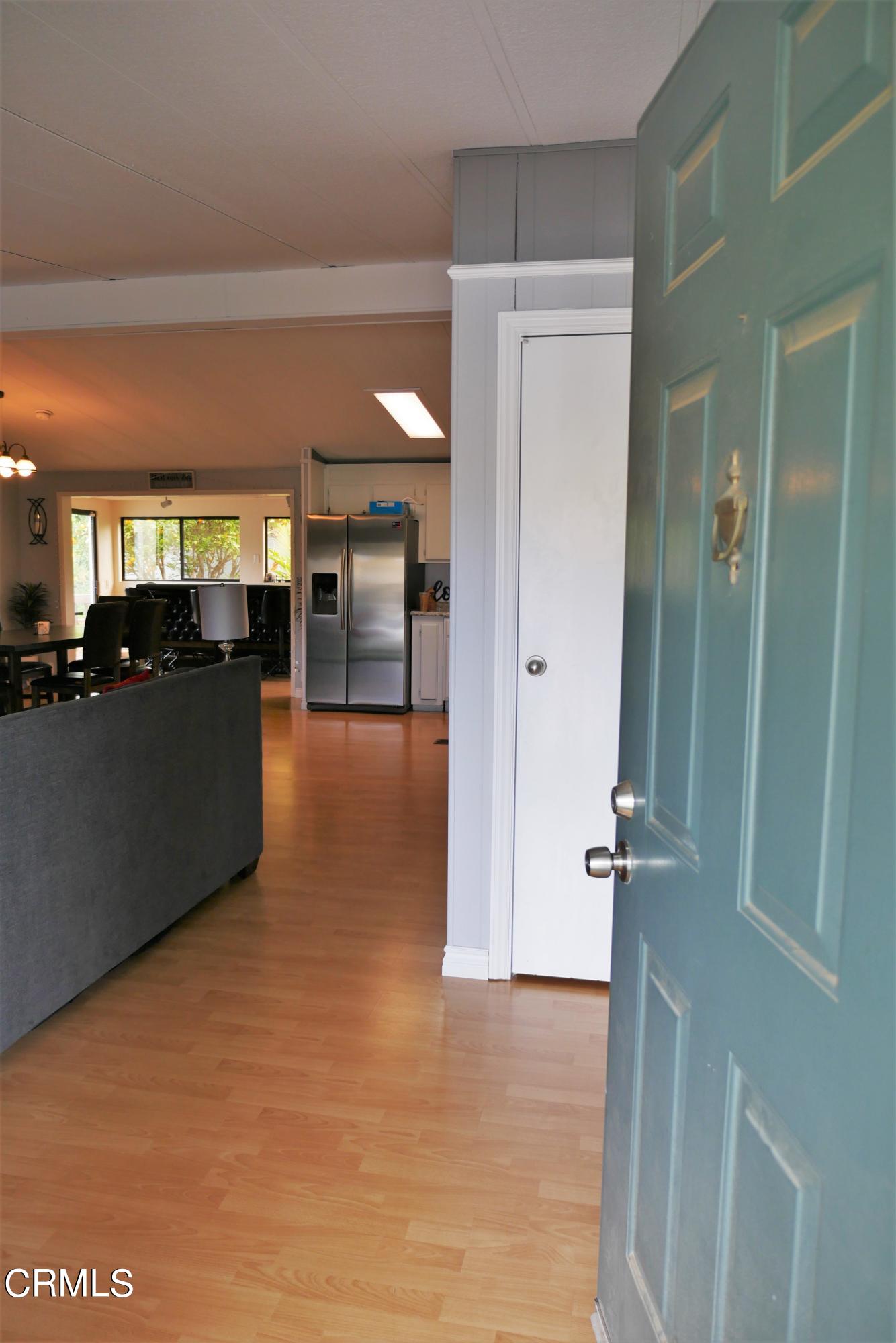 481 Raspberry Place, Unit 112 Oxnard, CA 93036 - Photo 3 of 18 a view of a hallway with an empty room