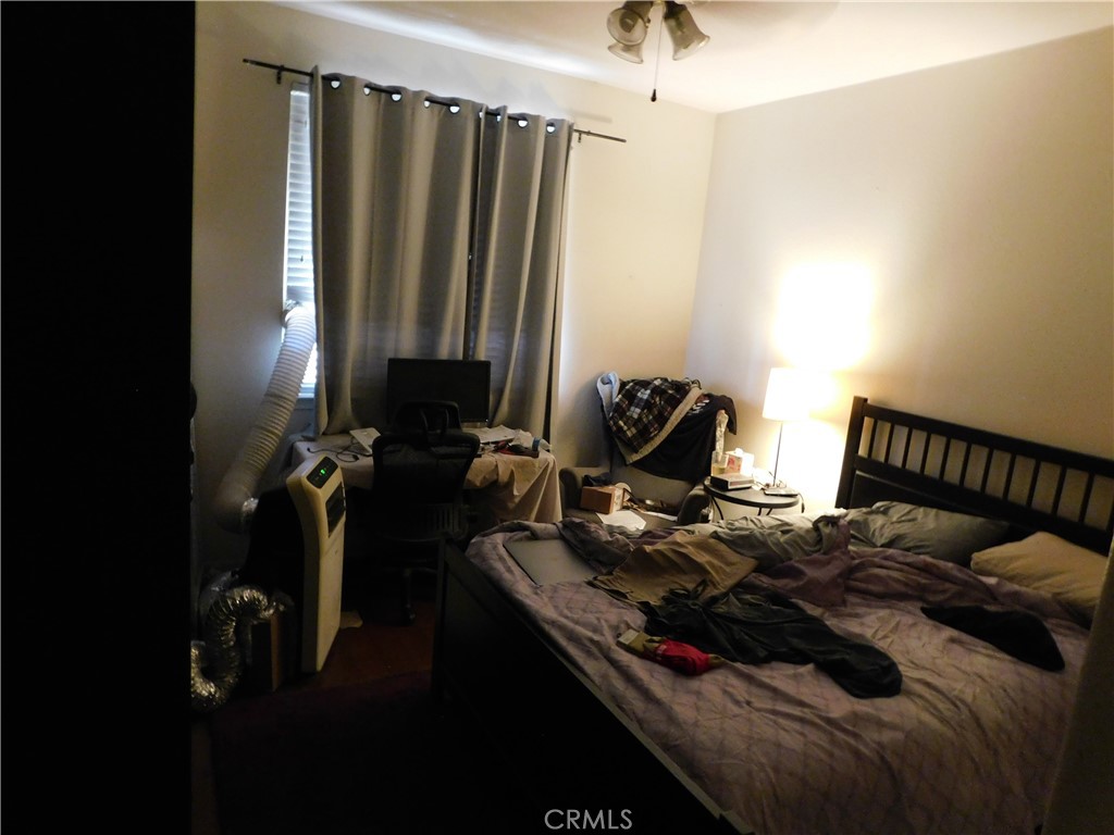 1216 Aups Court Merced, CA 95348 - Photo 24 of 45 a bed sitting in a bedroom next to a window