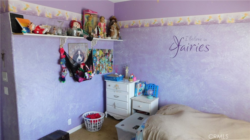 1216 Aups Court Merced, CA 95348 - Photo 29 of 45 a bedroom with a bed and a couch