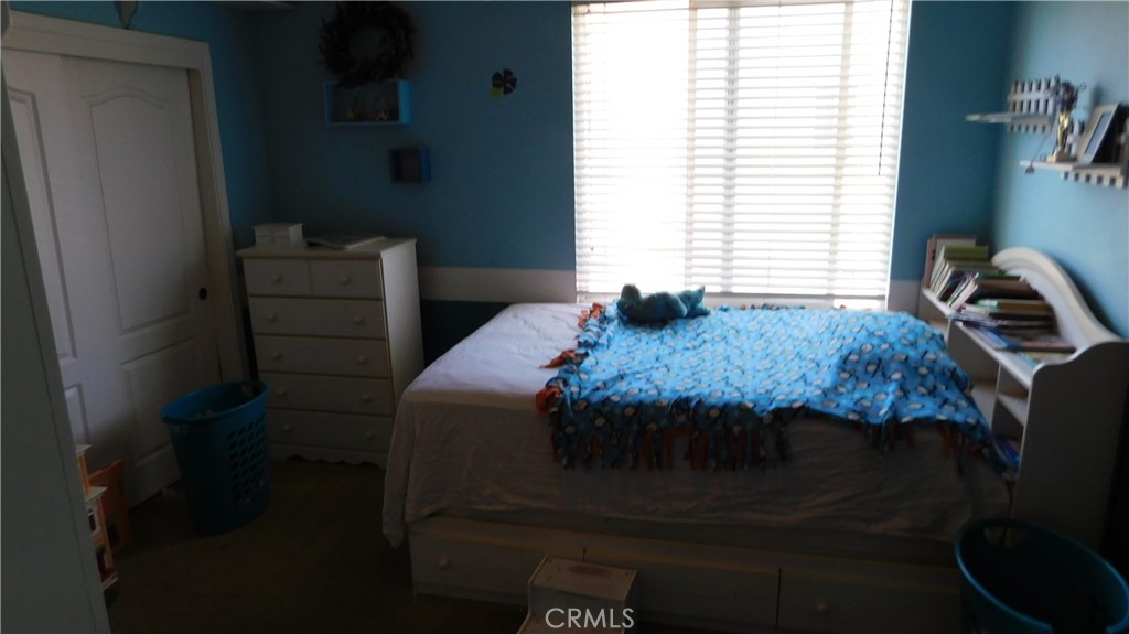 1216 Aups Court Merced, CA 95348 - Photo 34 of 45 a bedroom with a bed and a window