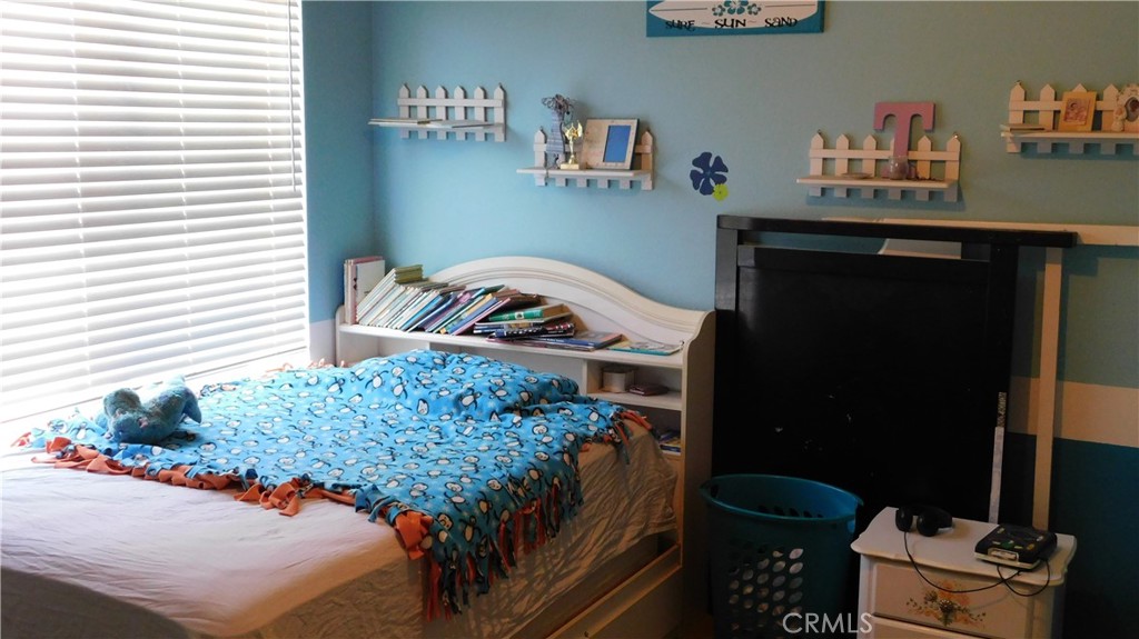 1216 Aups Court Merced, CA 95348 - Photo 35 of 45 a bedroom with a bed and a window