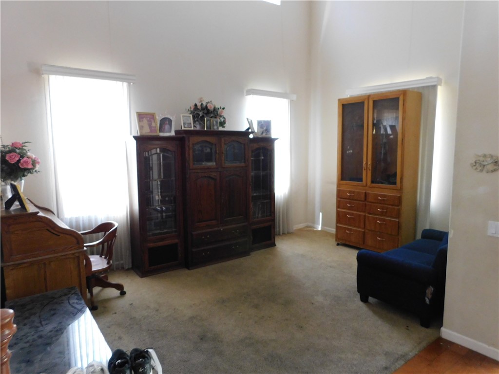 1216 Aups Court Merced, CA 95348 - Photo 5 of 45 a living room with furniture and a dresser