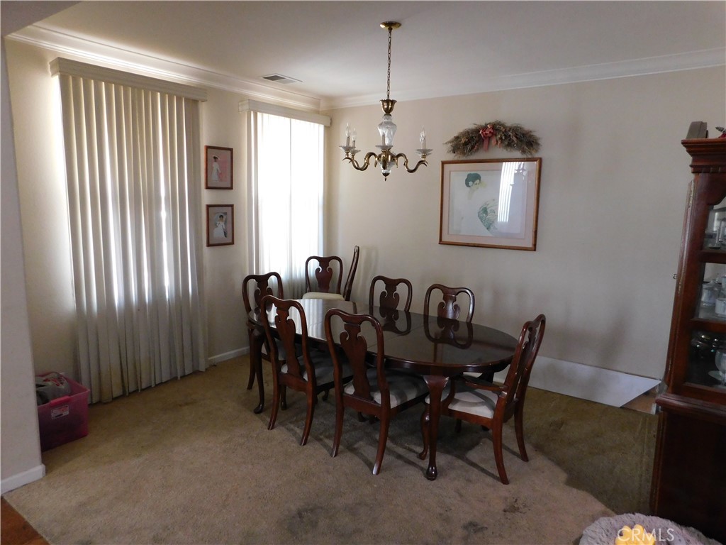 1216 Aups Court Merced, CA 95348 - Photo 9 of 45 a view of a dining room with furniture window and outside view