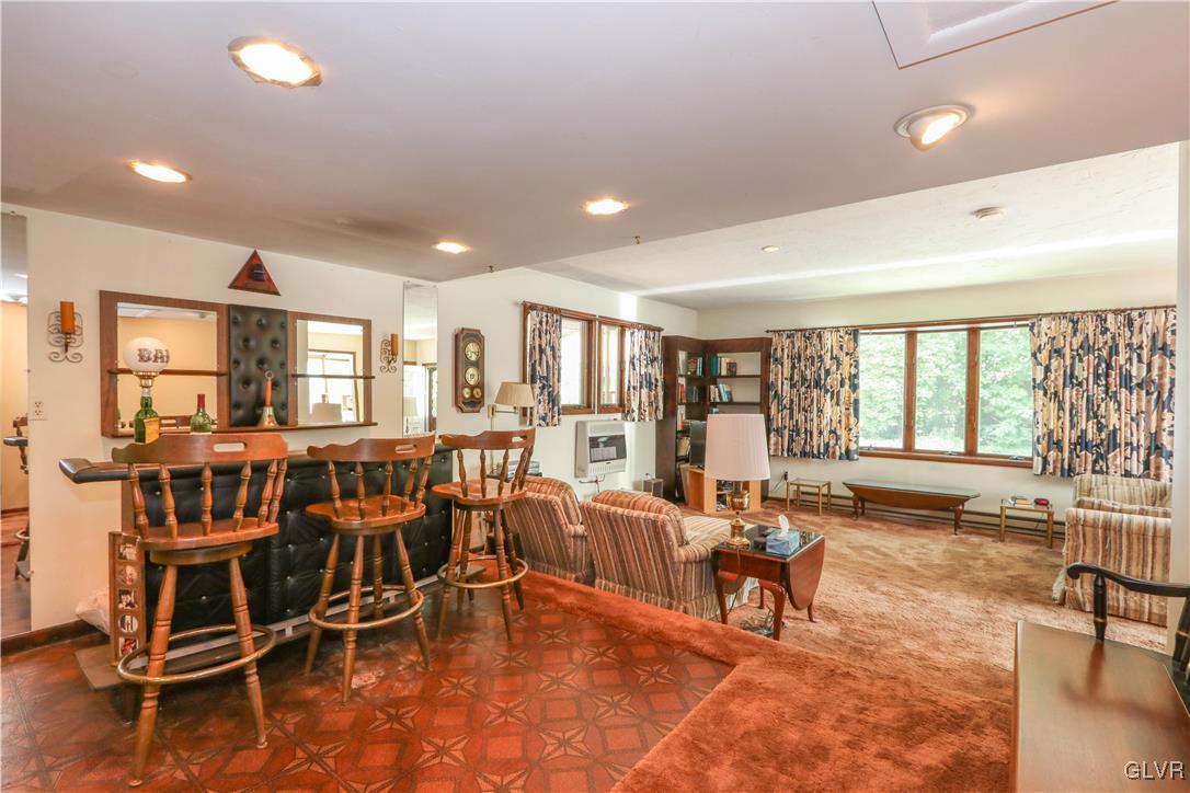 1271 Kilmer Road Tobyhanna, PA 18466 - Photo 14 of 36 a living room with furniture and a large window