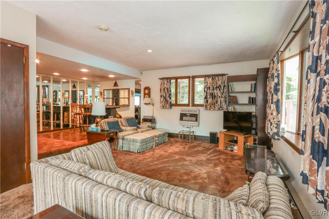 1271 Kilmer Road Tobyhanna, PA 18466 - Photo 15 of 36 a living room with furniture and a flat screen tv