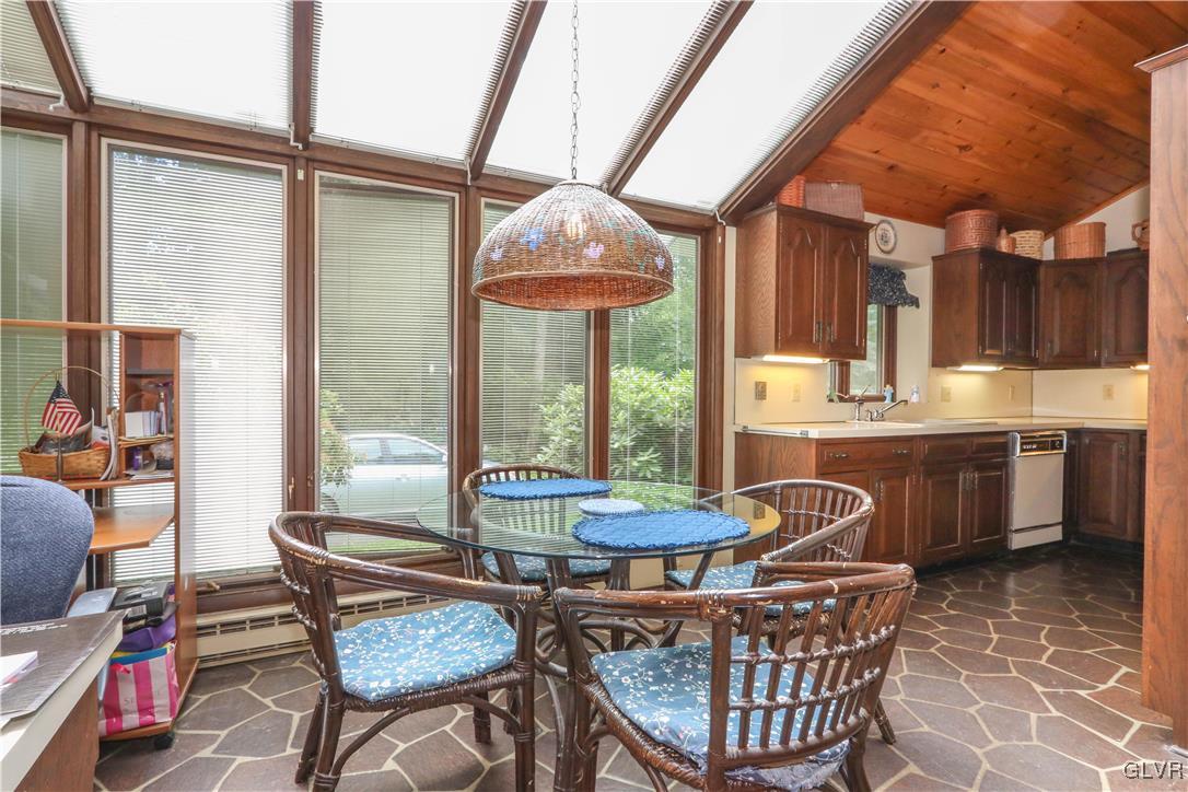 1271 Kilmer Road Tobyhanna, PA 18466 - Photo 19 of 36 a dining room with furniture a chandelier and wooden floor