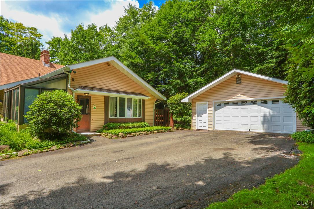 1271 Kilmer Road Tobyhanna, PA 18466 - Photo 32 of 36 a front view of a house with a yard and a garage