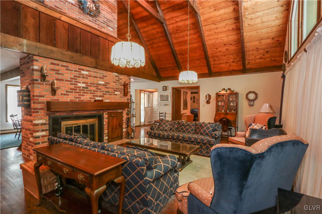 1271 Kilmer Road Tobyhanna, PA 18466 - Photo 7 of 36 a view of a patio with couches table and chairs with wooden floor and fence