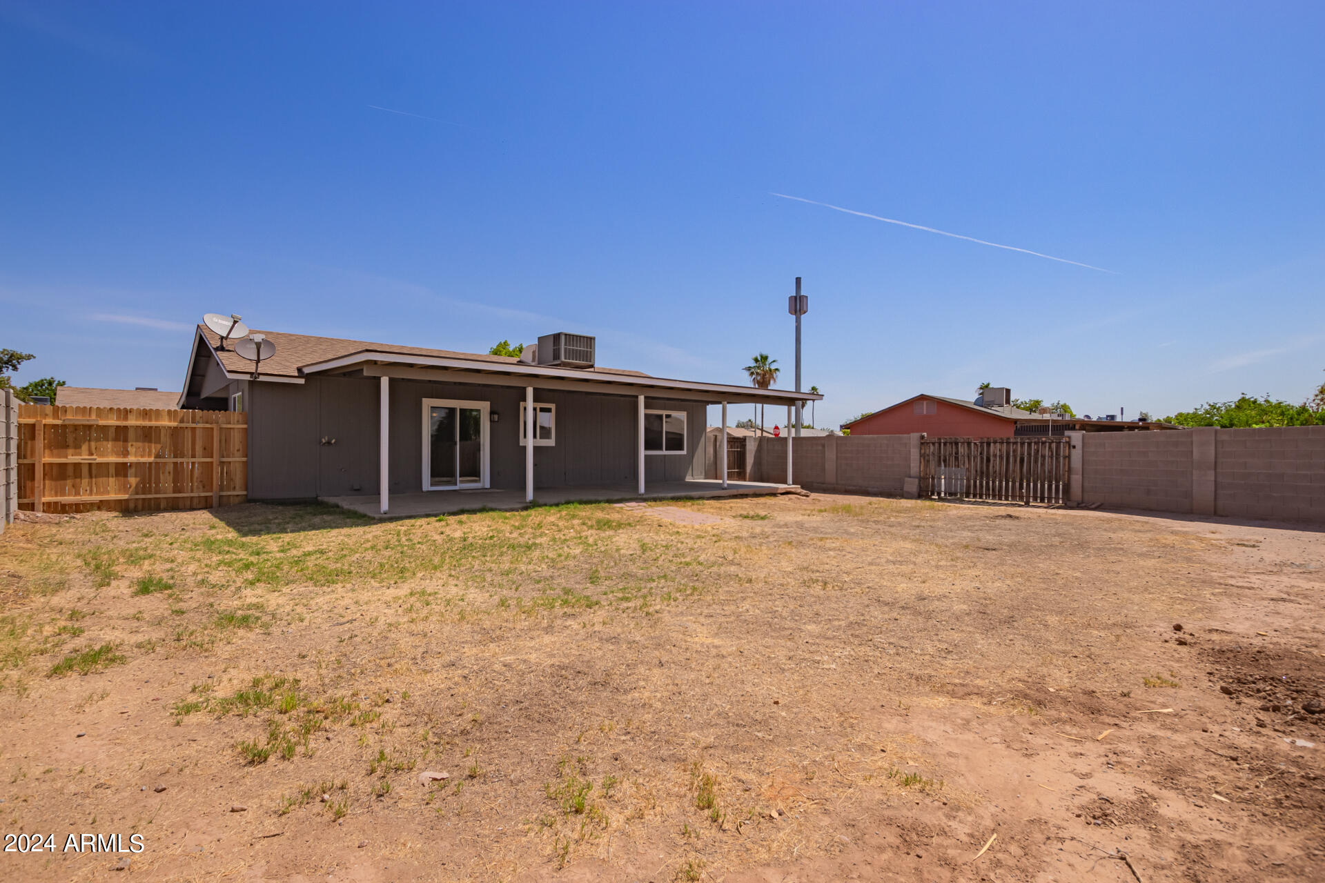 7231 West Flower Street Phoenix, AZ 85033 - Photo 18 of 22 a view of a house with a outdoor space