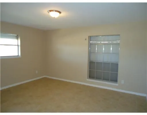 an empty room with a empty space and window