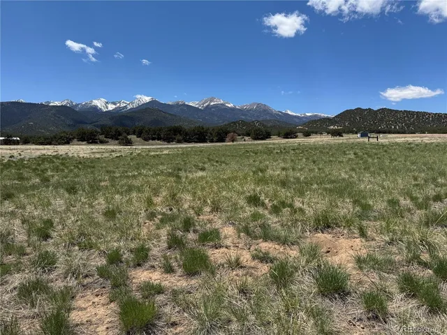 a view of lake with sunset in background