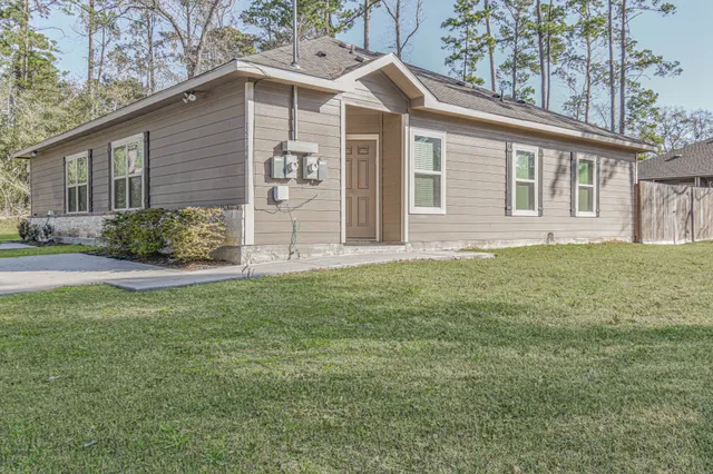 a front view of a house with garden