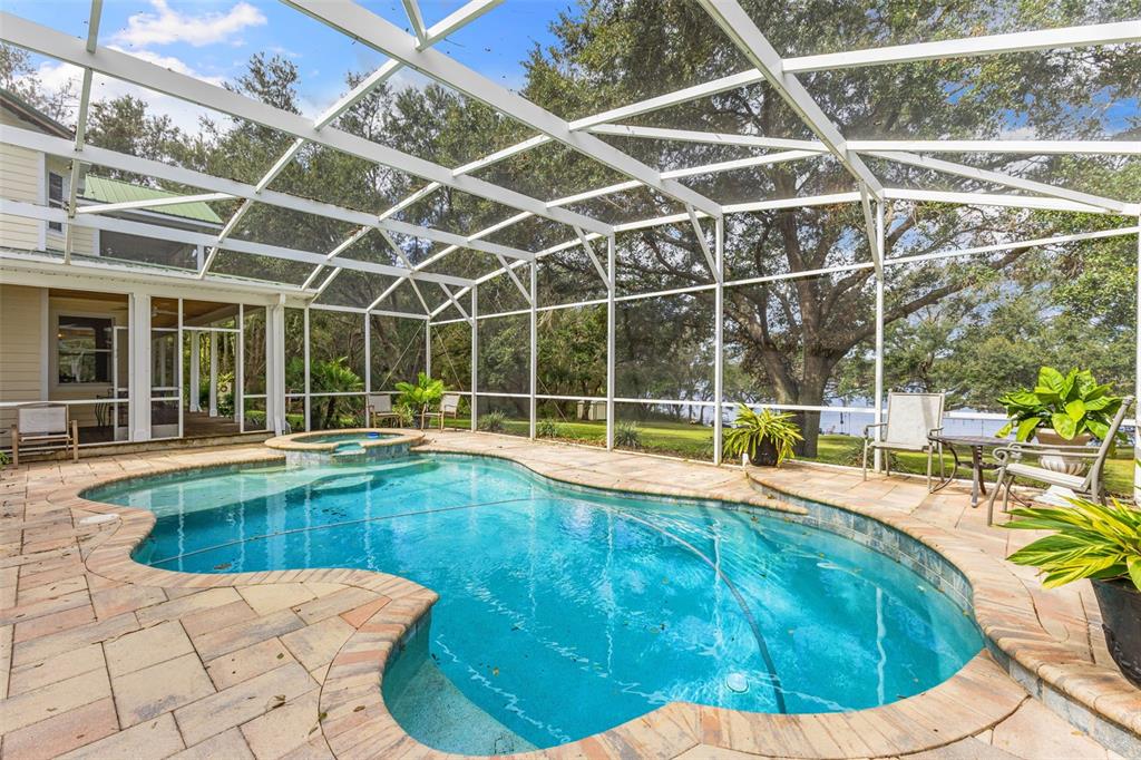 18725 South Obrien Road Groveland, FL 34736 - Photo 15 of 68 a view of a swimming pool with a patio