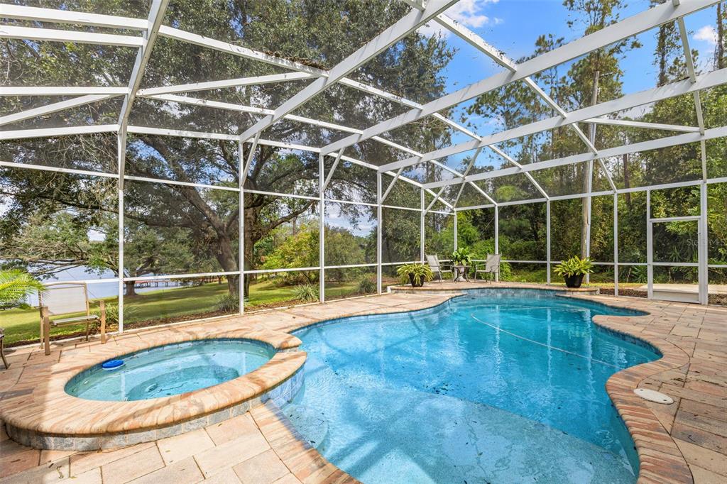 18725 South Obrien Road Groveland, FL 34736 - Photo 16 of 68 a view of a swimming pool with a yard