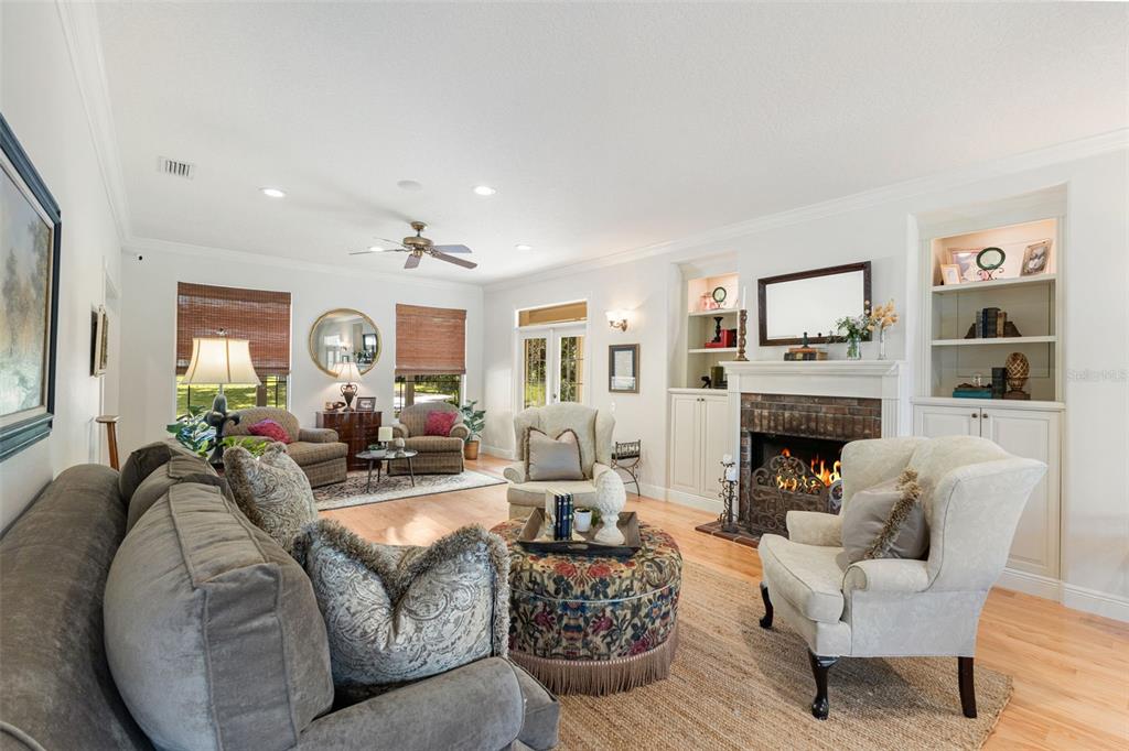 18725 South Obrien Road Groveland, FL 34736 - Photo 26 of 68 a living room with furniture and a fireplace