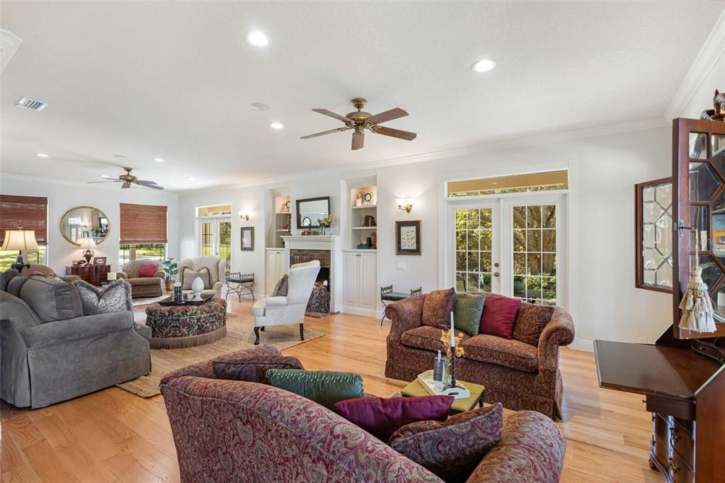 18725 South Obrien Road Groveland, FL 34736 - Photo 27 of 68 a living room with furniture ceiling fan and a window