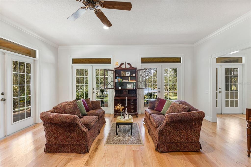 18725 South Obrien Road Groveland, FL 34736 - Photo 28 of 68 a living room with furniture and a large window