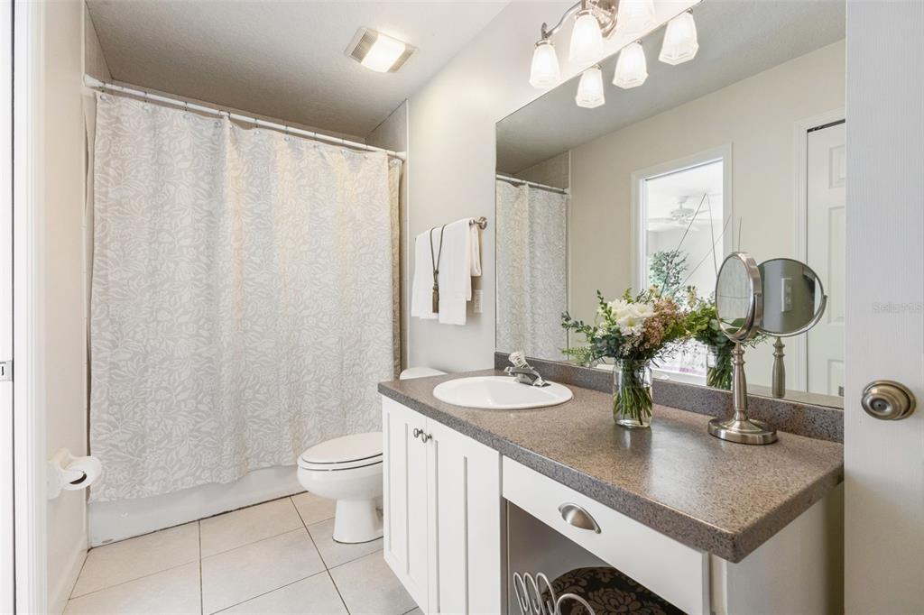18725 South Obrien Road Groveland, FL 34736 - Photo 47 of 68 a bathroom with a double vanity sink mirror and toilet